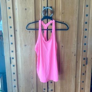 loose pink lululemon tank size 8, is a great workout top or a casual tank!